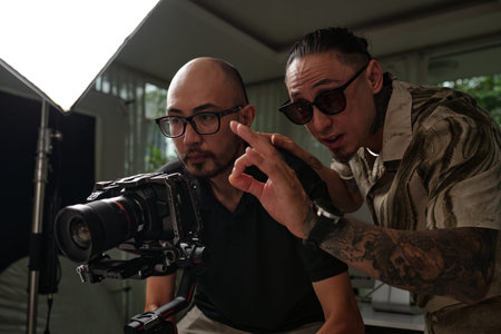 Director Controlling The Work Of Cameraman