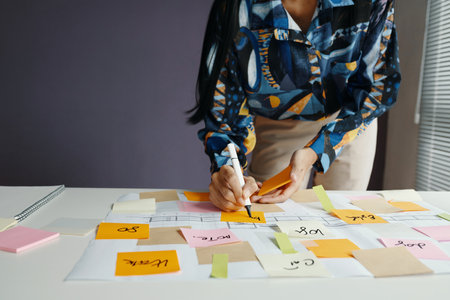 Unrecognizable Woman Working On Planの写真素材