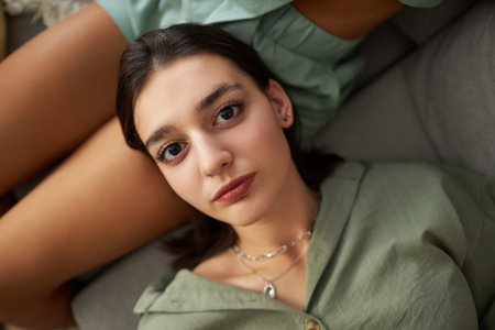 Gen Z Girl With Brown Eyes Looking At Cameraの写真素材