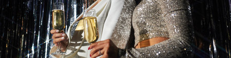 Celebrating New Years Eve Holding Champagne Glasses