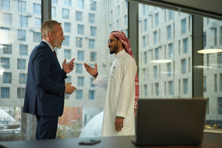 Two Diverse Businessmen Discussing Project