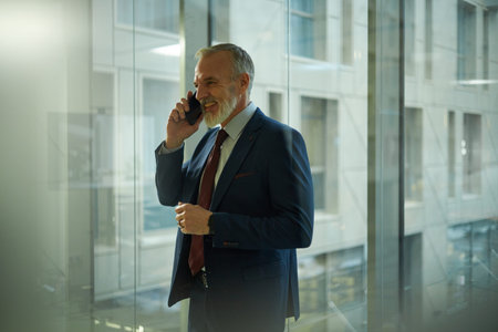 Cheerful Businessman Making Phone Callの写真素材
