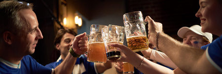 Header of group of sports fans celebrating together, raising beer mugs in bar, showing excitement...