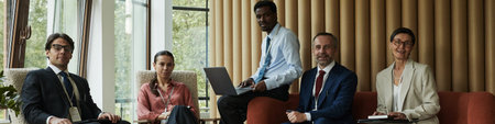 Header of diverse group of middle aged professionals sitting together in modern office, Black man...