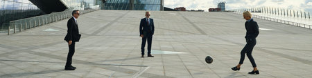 Header of three middle aged Caucasian business professionals standing outdoors on modern urban...
