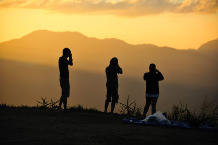 group of photographer in the sunset