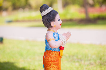 Thai doll is in garden の写真素材