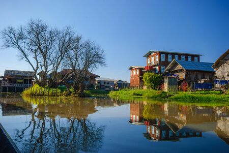 INLE LAKE, MYANMAR - DESEMBER 28: Floating houses in a village on DESEMBER 28, 2009 in Inle Lake, Myanmar. Inle lake is a famous lake for tourism in Myanmar.のeditorial素材