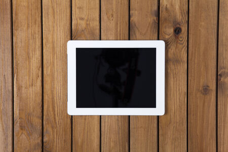 Digital tablet on the wooden deskの写真素材