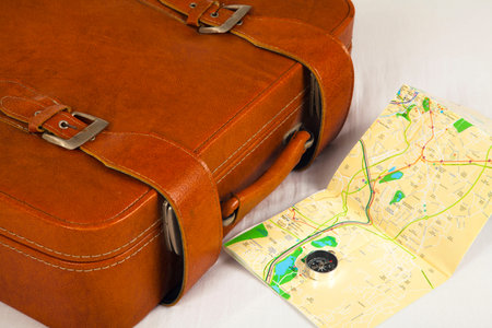 Retro suitcase on bed for traveling