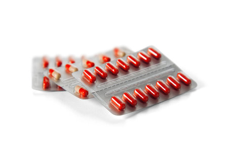 Pill capsules on white background
