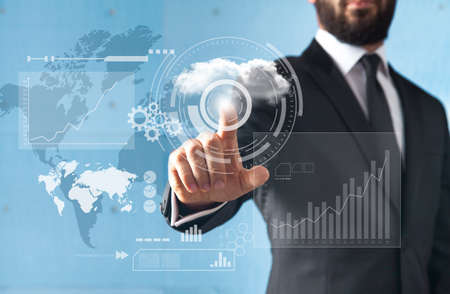 Businessman standing and working with touch screen technologyの写真素材