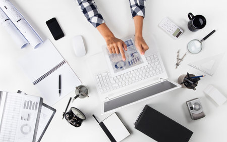 Overhead View Of Businesswoman Working At Tablet PC In Office