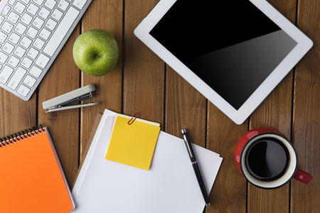 Office material on wooden background, directly above shotの写真素材