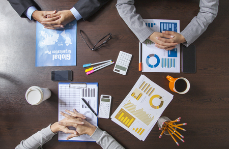 Group of Business People Working on an Office Deskの写真素材