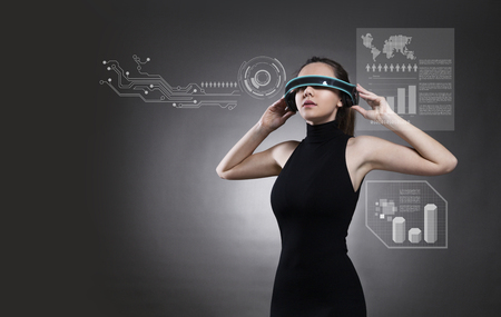 Attractive brunette woman with futuristic glassesの写真素材