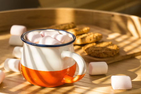 Cup of hot cocoa with marshmallows on the wooden tableの写真素材