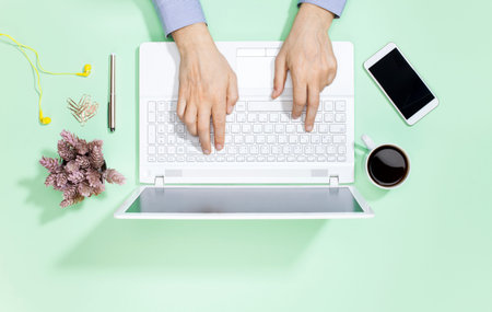 Overhead View Of Businessman Working At Computer In Office