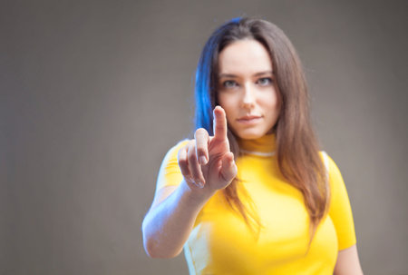 Young woman touching the empty screen