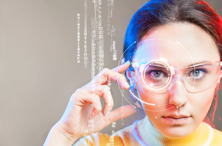 Young woman looking at virtual graphics in futuristic background