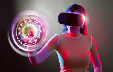 Young woman wearing virtual reality device over dark background. Virtual Reality digital concept...
