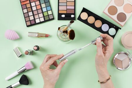 Beauty blogger opens her lipstick on dressing tableの写真素材