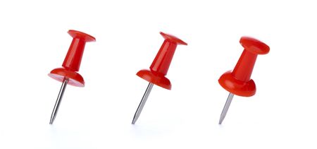 Close-up of pins on white backgroundの写真素材