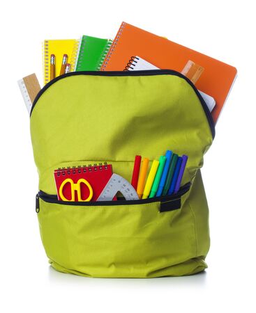 Green school backpack with school supplies isolated on white backgroundの写真素材
