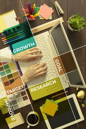 Business strategy on office desk. Business woman working in office at background and business strategy related motivation words at foregroundの写真素材