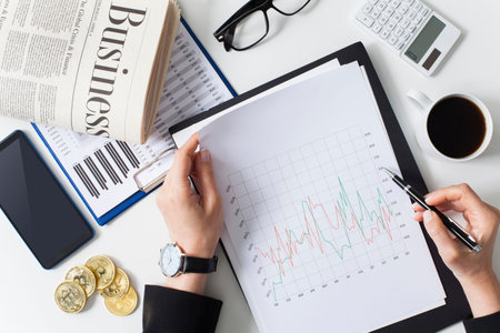 Close up businesswoman examining the situation on the market. Business financial concept. Data...