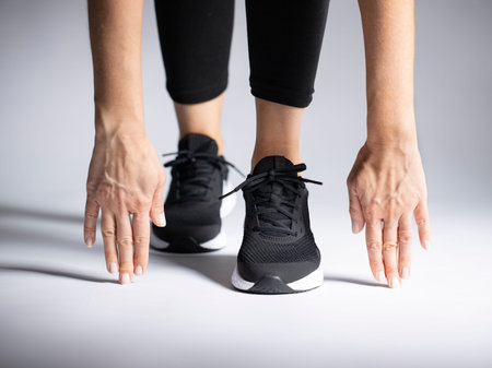 Woman preparing for track run race start