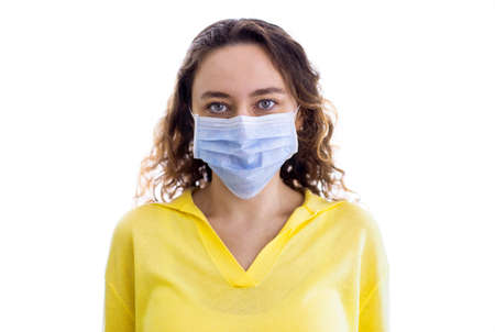 Woman wearing face mask at home.の写真素材