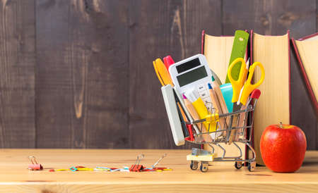 Stationery and office supplies in a miniature shopping cart. Back to schoolの写真素材