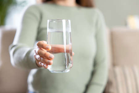 woman holding glass of waterの写真素材