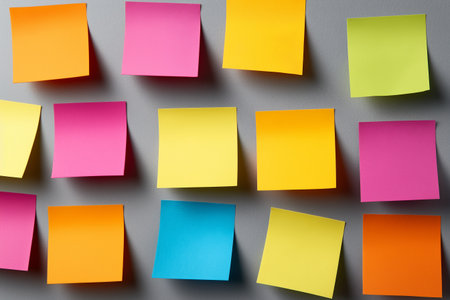 close up of colorful post it notes on a gray background, business conceptの素材