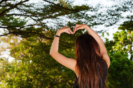 A girl love with tree in the worldの写真素材