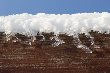 Snow on woodの写真素材