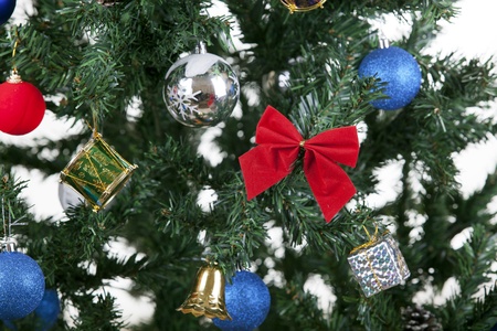 a close up christmas toys on a treeの写真素材