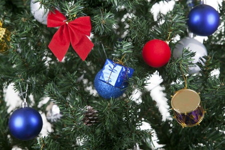 a close up christmas toys on a treeの写真素材