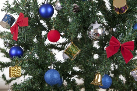 a close up christmas toys on a treeの写真素材