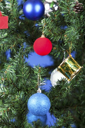 a close up christmas toys on a treeの写真素材