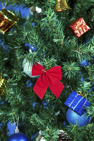 a close up christmas toys on a treeの写真素材