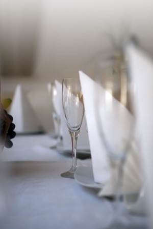 A beautiful shot of a glass on a table inside a restaurantの写真素材