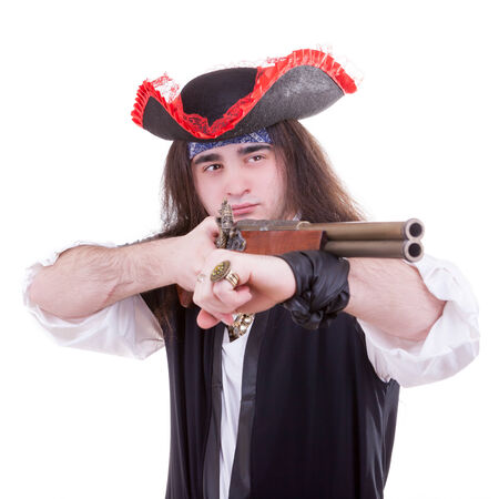 Pirate with a gun on hand isolated on white backgroundの写真素材