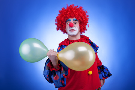 Clown with balloons in hand の写真素材