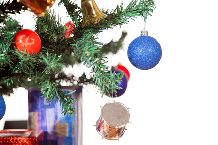 Christmas ornaments in tree isolated over white background. Blue ballの写真素材