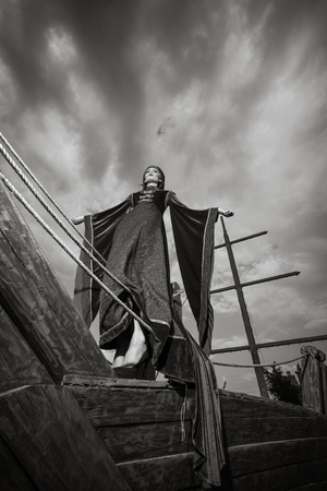 Girl on boat in vintage clothes and deep skyの写真素材