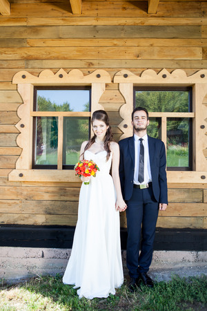 Bride and groom laughing and holding each other hand. Happy familly. Wedding. Wedding photography. Weddin photoの写真素材
