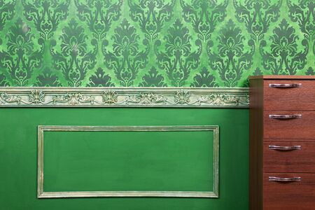 Interior of room painted in green with vintage elements. Retro baroc pattern. Rich vintage interiorの写真素材