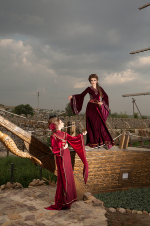 Gorgeous women in retro vintage clothes on boat. Fashion styled shooting. Retro vintage periodの写真素材